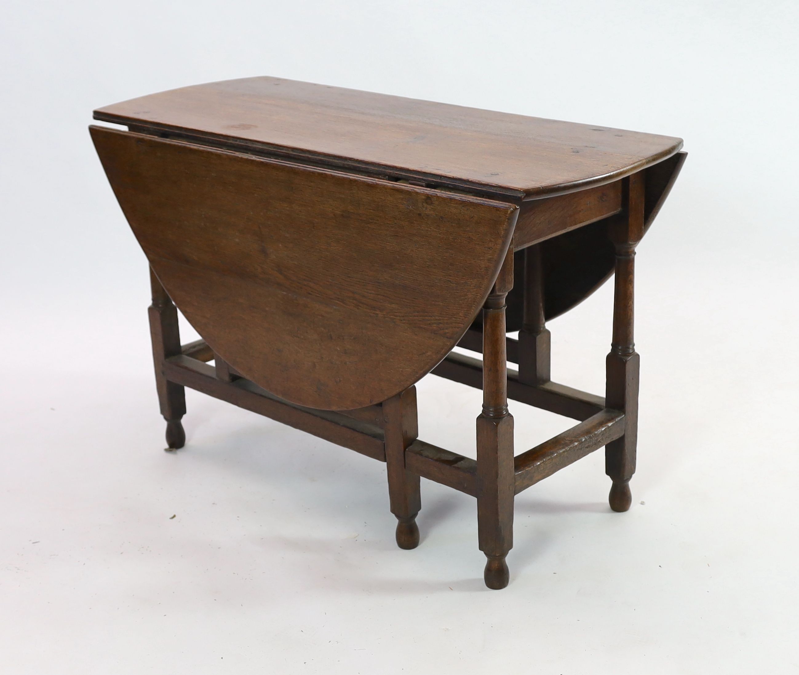 An 18th century oak gateleg dining table, 140cm extended, width 51cm height 75cm